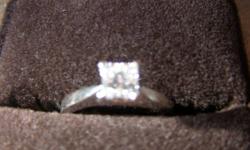 Diamond Ring in time for Valentines Day!  If you are planning on proposing to that special girl here is a 14 karat white gold ring with 4 prongs. 
.70 carat - very good cut.    Princess cut natural diamond.
Have certificate of origin for interested buyer