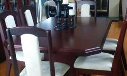 Beautiful 10 piece dining set includes table, extension, one armchair and 5 chairs and a 2 piece buffet. Table size: without leaf is 75(w)x41(d)x31(h), with leaf is 91(w)x41(d)x31(h). Does not include china. Pick up in Carleton Place.