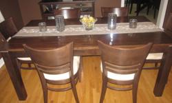 Dining room table, six chairs, and matching buffet. Furniture never used, moving sale. Great price, great condition!