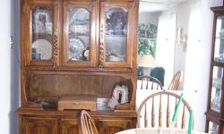Solid wood dining room set with four chairs, and matching hutch. Table has removable leaf . Asking $450.00 or best offer. Please call 5198260097. please no e-mails