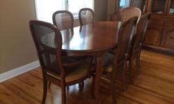 Large table, comes with expansion shelves and 6 chairs. Matching buffet cabinet.