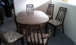 Dining Room table, includes six chairs, one of which is an armchair.  Has two leaves to extend the table length.  Upholstery is 'dated,' but wood is in great shape.  Seller cannot deliver.  Make me an offer!  Contact through email or on my cell