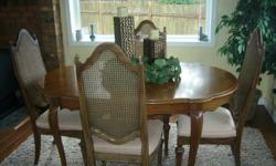 Solid wood dining room table, with 3 regulars chairs and 3 captains chairs. Sturdy and in good shape. $225.00 OBO