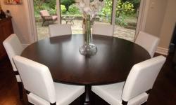 Circular dining room table, comfortably seats 8.  Purchased from Crate and Barrel 2 years ago for $2000 incl tax.  72 inches in diameter.  Includes table only, not chairs.