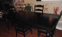 Dining table and 6 chairs Good Condition. Comes with a centre leaf for extension to 6'8". Call 403-357-9652