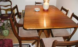 Dining room table with six chairs, walnut, made by Gibbert.  Very good reproduction made in  the 1947
Please call 902-579-5552. No not e-mail.
