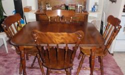Dining room table and hutch for sale. Both in excellent condition, $175 for both.