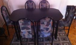 Excellent condition the table adjustable with mattress same color matching the chairs