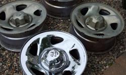 Originally bought to use on a Ford 1/2 ton. At one time you could swap back and forth. Not any longer. 4 Dodge 1/2 ton 16" chrome rims. 3 need to be cleaned up. Caps included. $100 or best offer