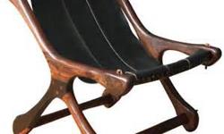 1960's Leather Sling chair. Unique and exquisitely crafted.
Solid Rosewood Frame,heavy Black leather seat sling.
Excellent Condition. Photo is from internet, mine is as fine or in better condition. I have researched this piece and it is a very good deal