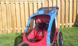 Double Chariot Cabriolet for sale $400 OBO.   
 
Comfortable, secure transportation with lots of room for one or two children (100lbs max with 5 point harness).  Includes lightweight Chariot chassis, removable 2-in-1 weather cover (adaptable weather