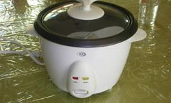 Durabrand Rice Cooker
I think that it's a 6 cup capacity - Instructions are with it. These aren't expensive, but new it would be $20