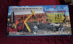 2.6.0 Camelback Express with real smoke, also a Coal Bunker Model Kit.
Never opened - still in boxes. $85.00. GREAT CHRISTMAS GIFT!!!