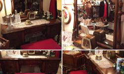 Lovely vintage 1920's Walnut Vanity with burled walnut drawers. Original bench. Made in Kitchener Ontario by the AnthesBaetz Company. Vanity is 48" long, 19" deep and 59" high to the top of the mirror. Bench is 14" X 26" and 18" high. One of the best