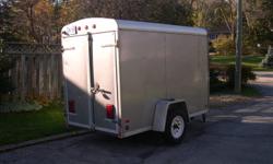 Trailer 10by5 feet 6feet high inside 3500lb torsion axle made in hamilton 6years old excellent shape