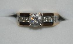 14kt yellow & white gold engagement ring
1 round brilliant cut diamond .80 ct
6 princess cut diamonds approx .52 ct
replacement value $8,300
See certificate