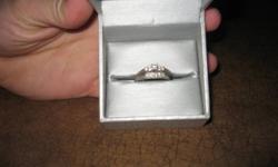 Stunning classic engagement and wedding band set. Size 7. Both 14kt diamonds with white gold bands. Worth over $1000.00.