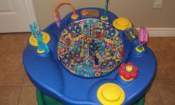 Great exersaucer for sale by Evenflo.  Adjustable to 3 heights.  Baby can spin, bounce and rock or it has 3 little feet on the bottom you can pop out to make the exersaucer stationary so it doesn't rock around.  Has 6 toys (4 are removable and