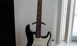 Mexican Fender Fat Strat, with extra humbucking bridge pickup and whammy bar. In great condition, with a gig bag included. Plays beautifully with that amazing Fender tone!