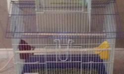 I have 2 cages and 3 birds for sale in excellent condition. The purple cage is extra nice Two birds are zebra finches and the other one is a very nice masked finch. Complete with all accessories and food. Great little pets. Sell altogether or separate.