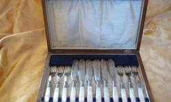 This is a simply lovely vintage set of 6 EPNS forks and knives, with Mother of Pearl handles, all in their original box.
I do not know the date of origin of this set, but one can not help but feel a sense of history when looking at it. There is a signed