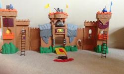 From clean non-smoking home. Like new. Fold out Knights' castle with Knights, cannon, catapult and ladders.