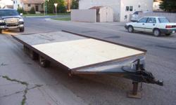 Flat Bed Trailer - Deck-16' x 8'- 2' extension at front - ramp fits under trailer & can be used at rear or front - tires 18.5x8.50x8-asking $1650.00 obo  jack  306-789-7940