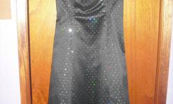 WORN ONCE great condition! Selling a formal Roberta dress! $100.00! firm. Dress looks better in person!
black with rainbow coloured sequins
size 11/12 but fits tight
one under layer of crinoline.
length - mid/lower calf, zippers at back
Located in