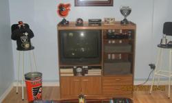 This entertainment wall unit (honey oak finish) and 27" RCA television are priced to sell at 0 dollars. The unit is a perfect fit for any cottage, den, family or rec room. It measures: H = 126.4 cm (49.75"); W = 123.8 cm (48.75"); D = 46.4 cm (18.25").
It