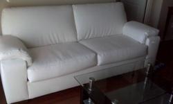 Just purchased it 4 month ago and paid $1400 for the sofa.  Custom made all lethar Sofa ? Made in Canada -  Solid wood base - 2 cushion. 85? in length and 35? in width.  Legs are solid brown wood. . Selling it because a change in decor. Has also a brown