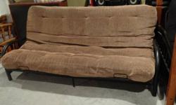Futon with beige cushion and black rod iron frame.
Please call in the evening or by email.