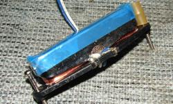 This is a BRAND NEW American Fender Telecaster neck pickup.
It is a HOT ALNICO 3, and measures 11.23k on my meter.
This is the pickup that was standard on the highway one guitars,
amongst others.
As you can see, it still has the plastic still on it, it
