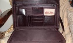 Laptop bag, Bugatti, Italy, genuine leather, brown, size 12 in. by 17 in. Can be locked with combination, shoulder strap is removable, excellent condition.