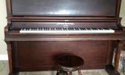 Long string upright piano, recently tuned, beautiful sounding instrument in good condition, comes with claw foot stool