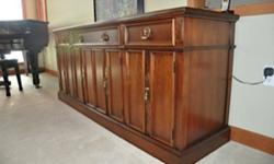 Solid Cherry in excellent condition Labels still attached
Measures : 20 in deep, 74 in wide and 32 in high
Structure: 3 drawers across top- one cutlery with felts, 1 wide drawer in center and 1 same size as cutlery drawer -4 doors across bottom
Drawers