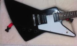 I've had this guitar for about 2 years, but now sadly parting with it. Its an ebony Gibson Explorer that sounds amazing, with minimal cosmetic damage. The damage is just some scratches from a belt on the back and a few very minor marks.
It comes with
