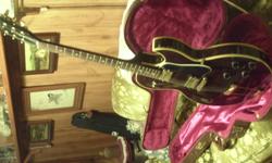 1998 Gibson ES 135 burgany woodgrain, all gold hardware with 2 humbuckers like new condition, beautifull guitar beautifull sound. This guitar is a limited edition commorating Gibson's 1998 Canadian tour.1900.00 O.B.O to view  call  705-793-9886