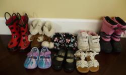 Here are 8 pairs of shoes / boots for sale. There is one pair of rain boots, one pair of cold weather boots, and one pair of stylish faux suede boots with pom poms and one pair of slippers. The other shoes are a pair of black dress shoes, running shoes,