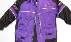 Girls Snoride snowmobile suite, purple / black in color, Bought new, worn three times, our daughter outgrew it before the season was over last year. Size 3/4  - She was a size four and it fit her fine. Warm, heavy duty zippers and snaps, Jacket with
