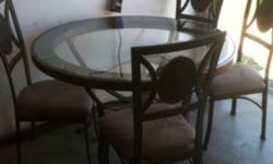 Glass dining room table with four chairs with slate rock around the edge of the table and the back of the chairs
This ad was posted with the Kijiji Classifieds app.