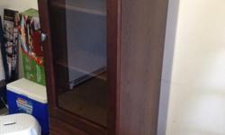 Med-dark wood cabinet. Two adjustable shelves. Two drawers. 59.25" tall x 20.5" wide x 18.75" deep. Excellent condition, no flaws.