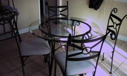 Selling glass top table (42" diameter), 4 chairs & matching bakers rack with glass shelves.  Good condition, $160 obo - avail immediately. Pick up only. Thanks for looking!