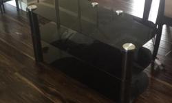 Tv stand mint condition. 3tier glass tv stand.
All black some silver,
TV has never sat on it. No bends cracks or chips.