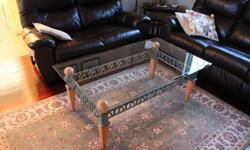 bevelled edge glass topped coffee table, a few minor scratches. Size 50"L x 30"W x 20"H