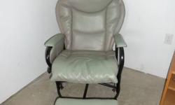 Faux leather gray glider and ottman, good condition. Must sell before this friday September 30.  Call 780-880-7679