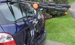 Adjustable bicycle rack for either sedan or hatchback car. Most secure with vehicles with rear bumper that rack can rest on.
Rack folds flat for storage or transport.
Rack and straps in good condition.