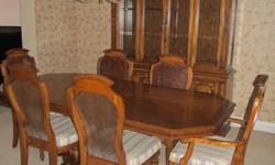 I have for sale a 9-piece solid wood (with some veneers) and very sturdy dining room suite purchased by us new in 1982 ? manufactured by the House of Braemore.  I do not remember the kind of wood but it is stained in a medium-coloured stain (a little