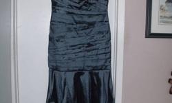 I have a beautiful JS Collections Dress for sale.  I purchased it at Cathy Allens in Lindsay for $340.00 and have worn it once.  It is a size 16 Taffeta.  I have a smoke free household.  Would be perfect for the holidays!!