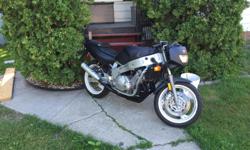 Great starter bike. Runs great !! This bike is a 1991 Yamaha 600 sport with individual air breathers after market exhaust tires like new everything works and it is plated and insurable with no liens owned free and clear. Only Kms 17,604 have to sell take