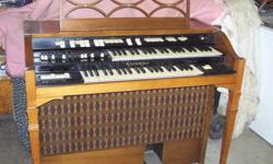 SOLID STATE ORGAN DOUBLE KEYBOARD CAME FROM A CHURCH MAY NEED SERVICE BEEN SILENT FOR SOME TIME.BUT WOULD LOVE YOU TO TICKLE HER KEYS.THE CABINET IS EXCELLENT AND IS COMEPLETE  MODEL-T-400-CAN96553 LAST SERVICED IN 1994.HAS LESLIE TREMOLO SPEAKER UNIT